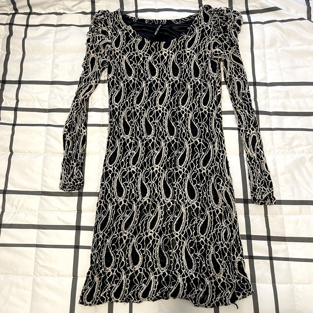 Form fitting stretchy puff shoulder dress.